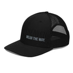 Black trucker hat with mesh back and text on a white background